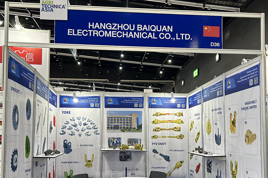 The picture shows a photo of BAIQUAN's booth at AGRI ASIA 2024, showcasing products such as PTO Shaft and related accessories, as well as agricultural machinery accessories.