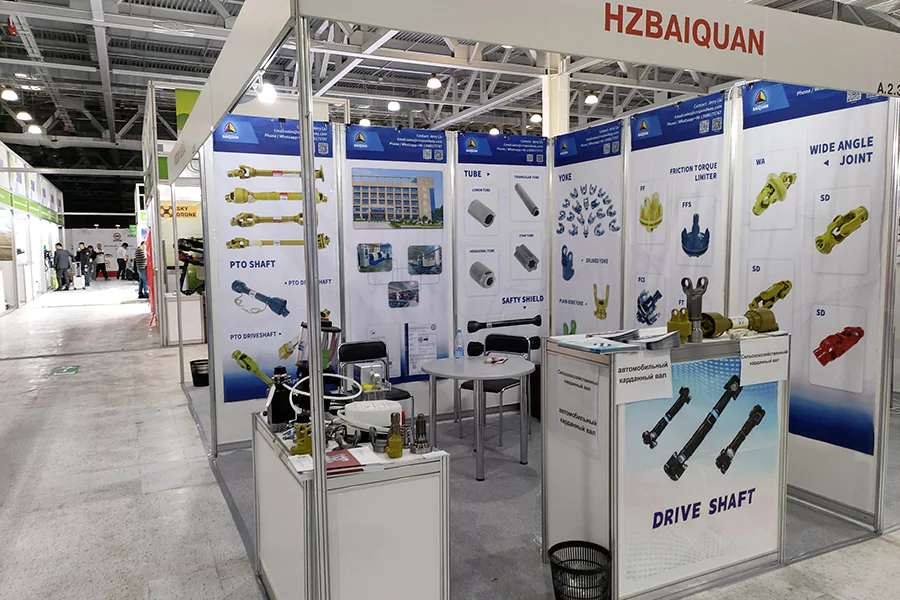 The picture shows BAIQUAN's booth photo at the 2024 SALON exhibition. The exhibited products include PTO Shaft related products and accessories such as tubes, Yoke, torque limiter, cardan joint, U-joint, safety shield, etc.