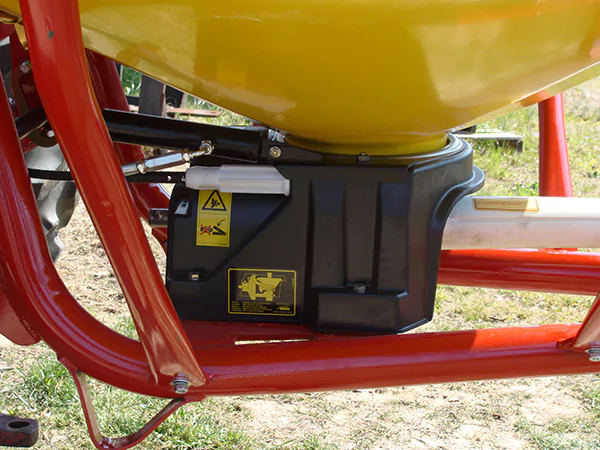 The picture shows a close-up photo of the Fertilizer Spreader Gearbox installed on the machine