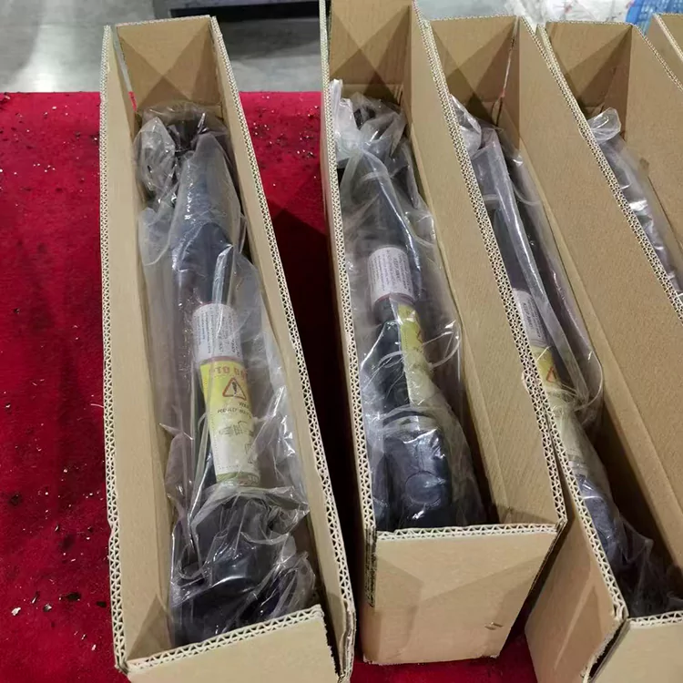 The picture shows the pto shaft placed in a separate cardboard box and covered with a separate plastic bag