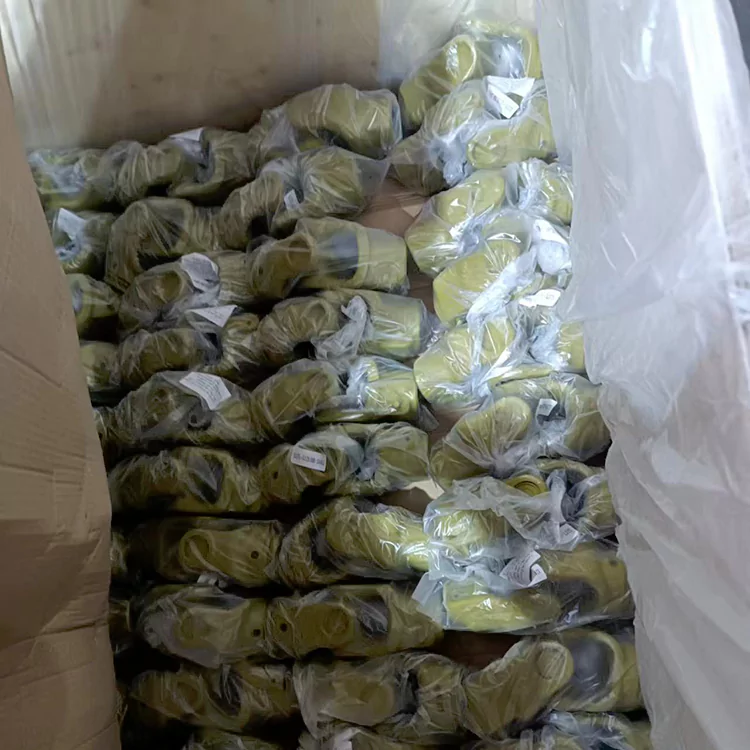 The picture shows yellow pto yokes with independent plastic bags placed in wooden boxes lined with plastic bags