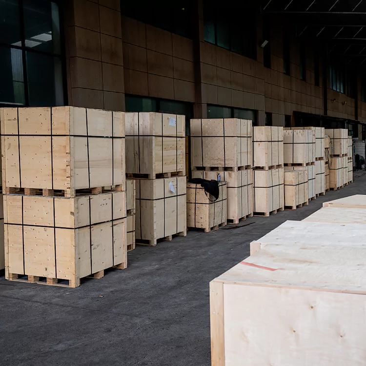 The picture shows the scene of wooden boxes stacked together in the delivery warehouse of BAIQUAN factory waiting for shipment