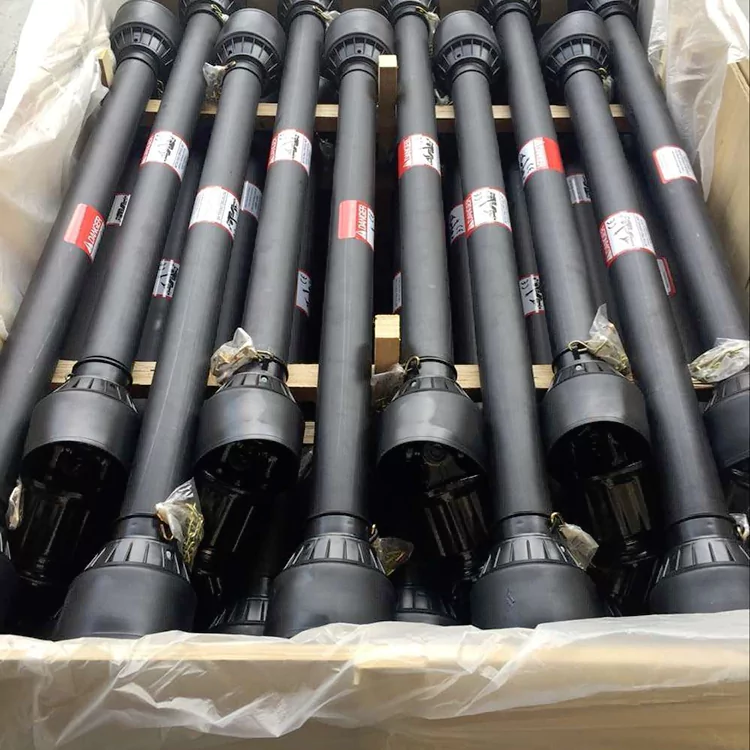 The picture shows black pto shafts with covers neatly arranged in a wooden box lined with plastic