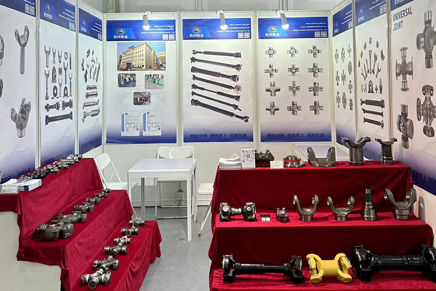 The picture shows BAIQUAN's booth photo at the 2024 BMW exhibition. The exhibited products include PTO shaft parts and construction machinery shaft parts