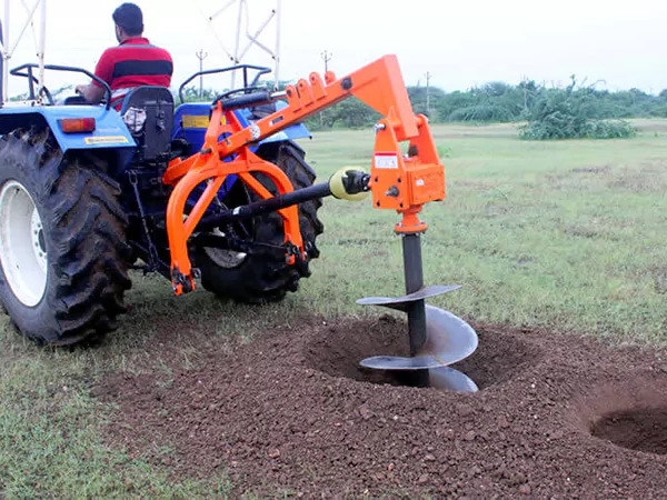 The picture shows a scene where Post Hole Digger gearbox is installed and working on a machine