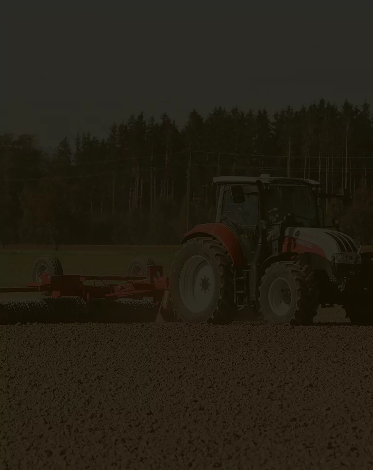 Modern agricultural machinery working in the field, showcasing efficient farming equipment in action.