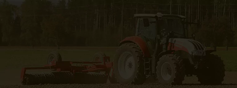 Modern agricultural machinery working in the field, showcasing efficient farming equipment in action.