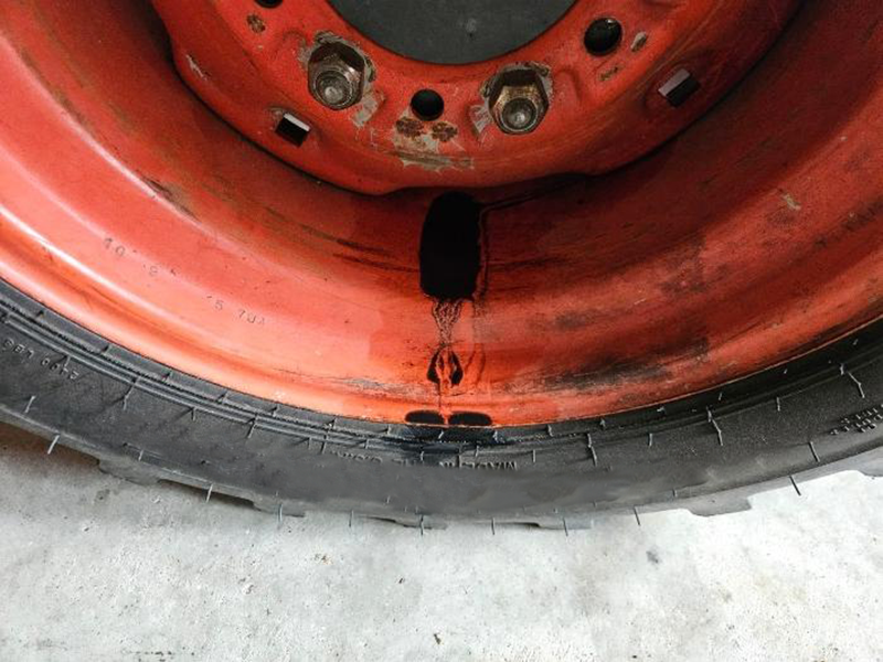 tractor wheel hub grease leak caused by bearing seal failure