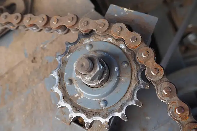 worn sprocket and chain showing agricultural equipment wear