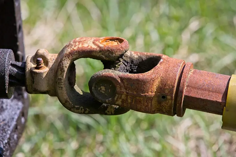 worn tractor PTO universal joint rust damaged